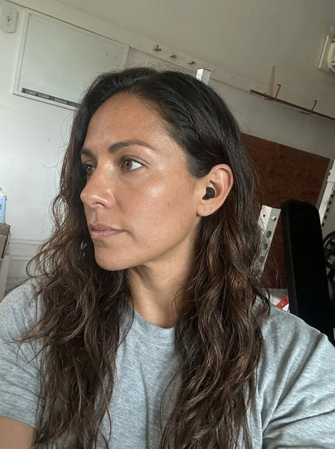 Alex C. wearing a Quiet earplug