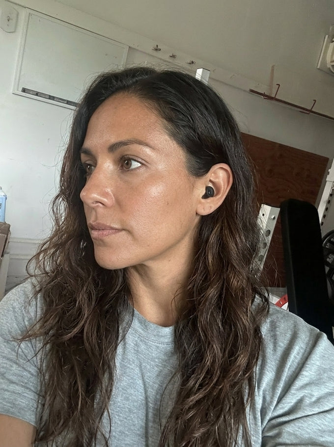 Alex C. wearing a Quiet earplug